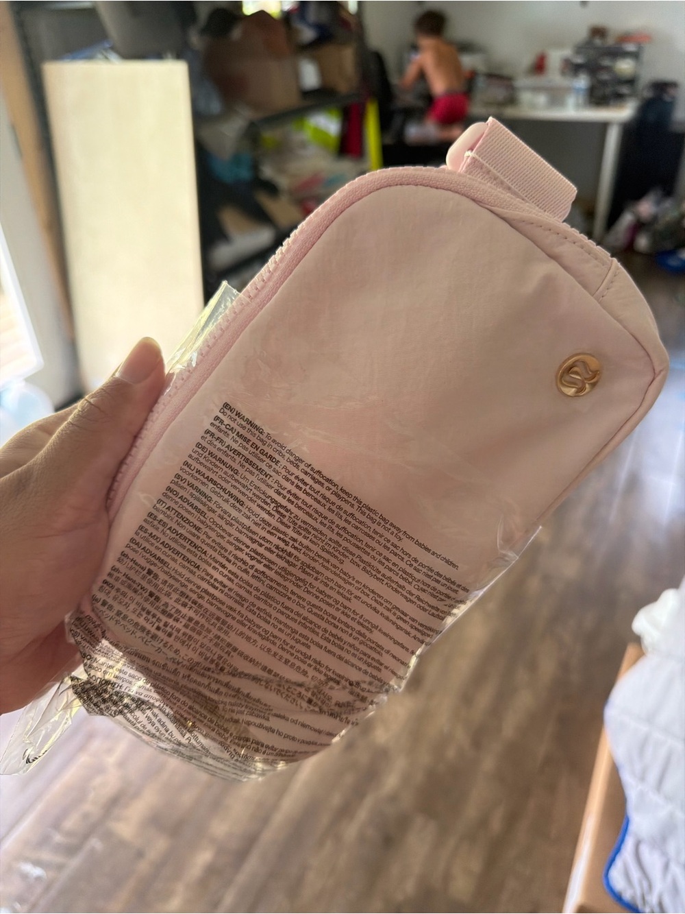 lululemon athletica light pink cosmetic wristlet with gold logo